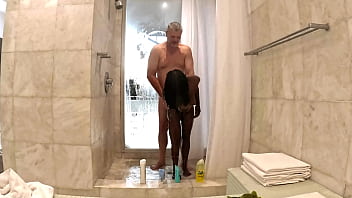 Fappking.com | Sexy Black Milf takes a hot steamy shower with white sugar daddy at his penthouse